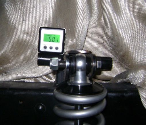 Drivers side on the a-arm mount tube. Still over a degree of difference. 