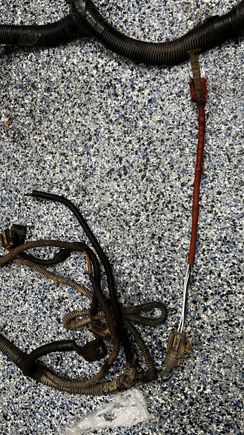 Here’s a Birds Eye of two connectors that are missing. The one off to the right and there’s one with 4 wires to the left. Closer picture of those cut wires below.