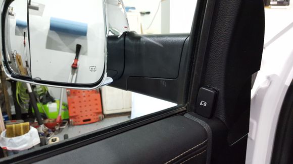 Switch mounted for aftermarket power folding tow mirrors.