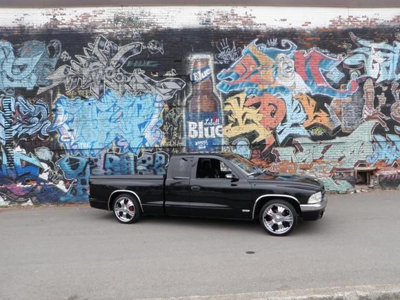 picture of my truck in front of a full wall of graffiti