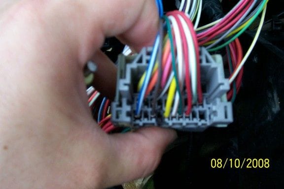 Remove the electrical tape and the rubber boot from the connector. right by my thumb there is a terminal outlined in black if you are counting them then it is the fourth one from the left with the open end of the connector facing you.