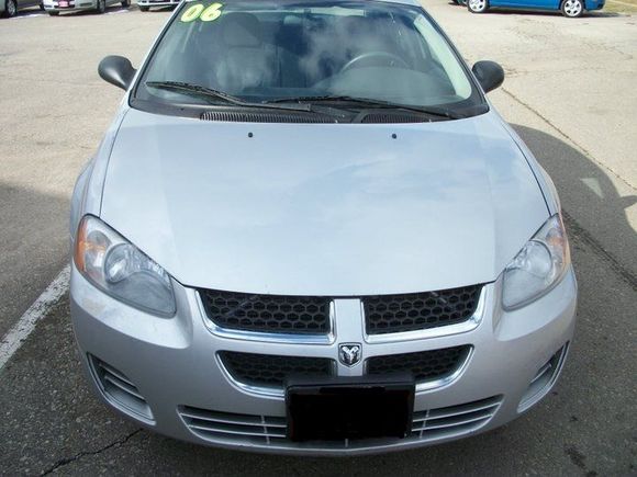 Just buying it still on the lot with the year sticker...you can see the bumper damage here...