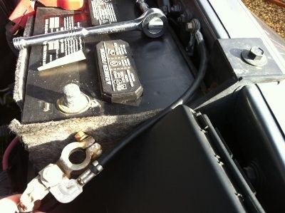 The stock setup.  One ground terminates on the fender (as seen) one goes to the engine block, and one to the frame accessible through the wheel well.