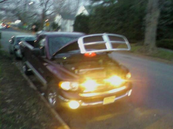 Installed behind the grill, no holes in the bumper