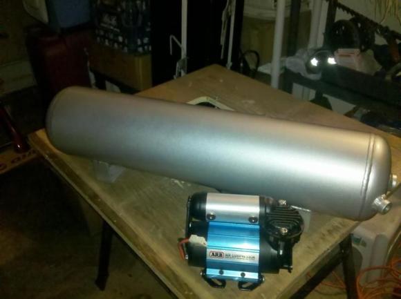 OBA - ARB Compressor and 5 Gallon Tank.

Comp on passenger fender
Tank above driveshaft and is removable.