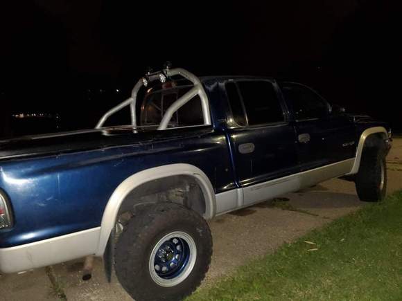 Ditched the topper & went with a fiberglass tonneau cover. Had a roll bar that I really liked the look of, but it would work with the cover. So more modifications & customizing come