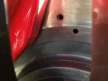 The gap at the top looks correct but should the inside of the caliper as in the gap from the bottom of the caliper to the rotor correct.( the the surface of the rotor)
