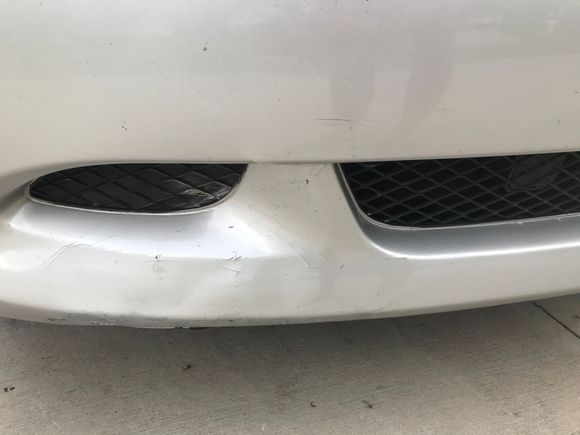How do I fix these paint cracks? Should I do it myself or go to a body shop?