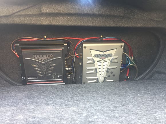 Heres the amps. Left amp is for my midrange speakers in the rear deck. Right amp is for the subwoofer. Its all hidden behind the sub.