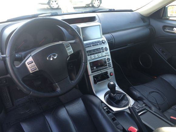 Stock interior when I got it. Steering wheel and shift knob left reside on my hands when I drove it and previous owner left tape adapter for music on phone.