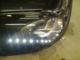 Stock Headlights with custom black paint and hand installed LED's down the trim!