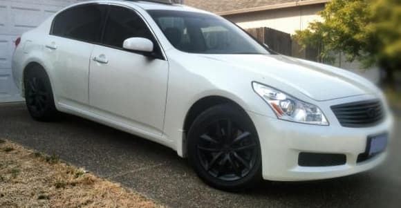 Blacked out wheels too. 20s comming soon lookin at vossen not sure if i wanna keep them black or go with silver. plan on lowwering too probably just springs. paint roof glossy ass black. BEFORE LOWERING
