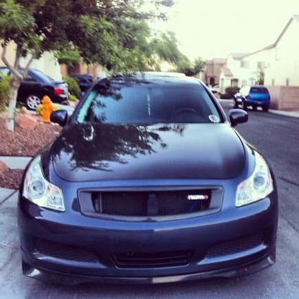 custom carbon fiber grill with gismo badge, extreme dimensions oem carbon fiber hood, aftermarket lip.