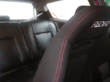 Had the back seats redone in black. Cost me $180. If I were to do it again id do suede instead of vinyl.
