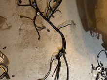 Here is the harness. You an see the plug that’s normal at the drivers side shock tower? It’s pulled back in as I explained. And the alternator wire is there lookin like a tail. 