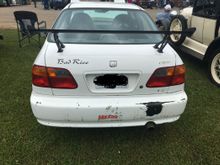 My wife made me that “Bad Rice” vinyl. The bumper needs...wait, no... the whole car body needs some TLC.