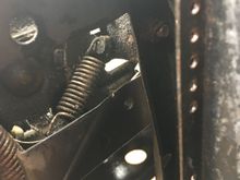 Tension spring for hood cable.