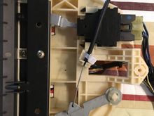 Took out the climate control module in order to zap strap the temperature cable sleeve. The original plastic holding it in place had gotten brittle and broken off. This is the underside.

I disconnected the harnesses further down in the centre console, rather than at the climate control module, so that I didn't have to take off the dash bezel and disconnect from the back.