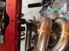 The compressor outlet is coming out right in front of the stock radiator mount, turbo needs clocked a hair towards the block but the housing will still be in the way of the radiator