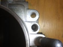 H23AV Idle screw hole is not open at the bottom and not tapped. The diameter is just a tad smaller than what is needed to fit the screw and gasket