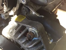 You can see where I ground (grinded?) the alternator case to clear the adjustment bracket.