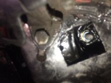 Inside car, under backseat. Several washers and one nut. POR15 rust treatment