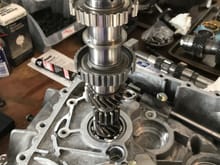 Stack up the mainshaft with 3/4th gear hub, spacer, 5th/R hub, spacer and bearing.
Dont forget the washer and cone washer.