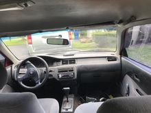from the backseat, top light doesn't work, steering wheel is crooked to the right 70% and a busted air vent but it could be a looot worse