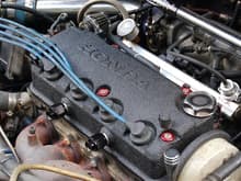 In this picture; DSM 450cc injectors, PWD:JDM valve cover washers, limited run vented oil cap, Vented valve cover, OBX fuel rail, FPR and liquid filled gauge. Braided fuel line.
