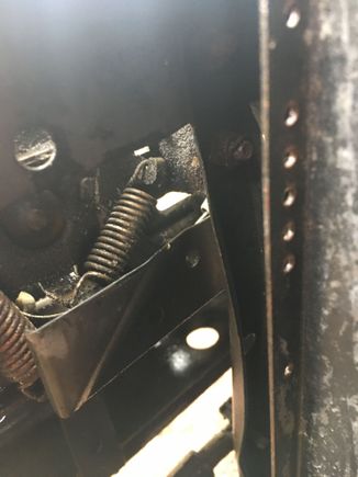 Tension spring for hood cable.