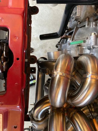 The compressor outlet is coming out right in front of the stock radiator mount, turbo needs clocked a hair towards the block but the housing will still be in the way of the radiator