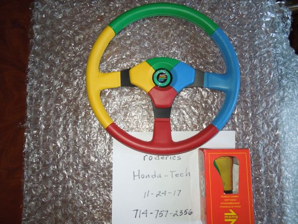 Momo Benetton F1 steering wheel with matching Momo Benetton multi-color shift knob.
$800
