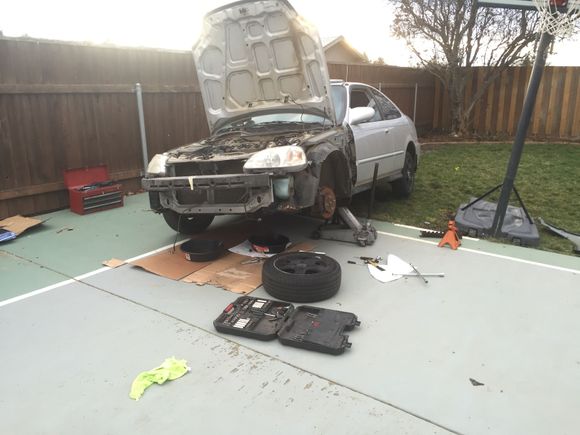 Gettin ready for the motor swap! 

Bumper is off because I was investigating non-working fog lights. Fenders are off because I'd rather have no fender than poop fenders.