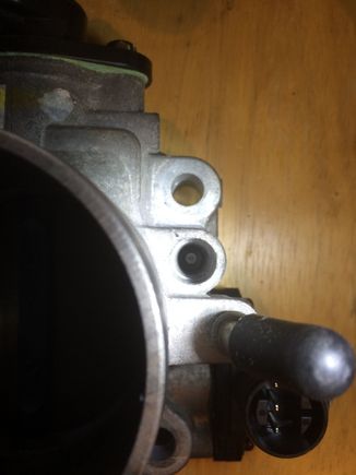 H23AV Idle screw hole is not open at the bottom and not tapped. The diameter is just a tad smaller than what is needed to fit the screw and gasket
