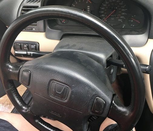 Leather wheel cleaned and refinished, looks decent.