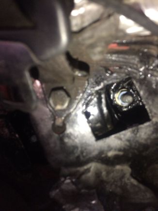 Inside car, under backseat. Several washers and one nut. POR15 rust treatment