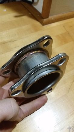 The flange closer to the camera slides up and down, and you can see the belled end on the pipe.