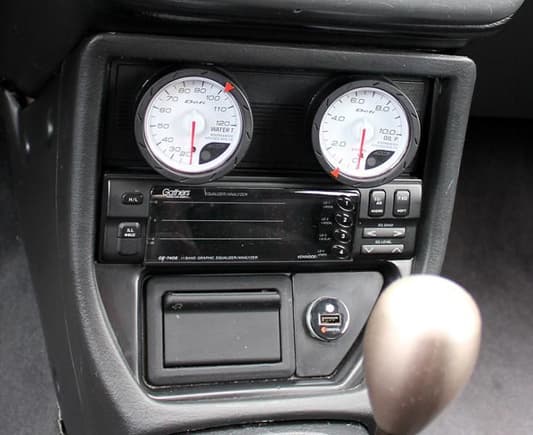 Defi oil pressure and water temperature gauges installed in the optional audio console, just above the Gathers 11-band EQ.