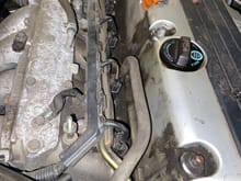 The skinny tube to the right under the oil cap is what is connected to the entire thing, I was scared of breaking it.