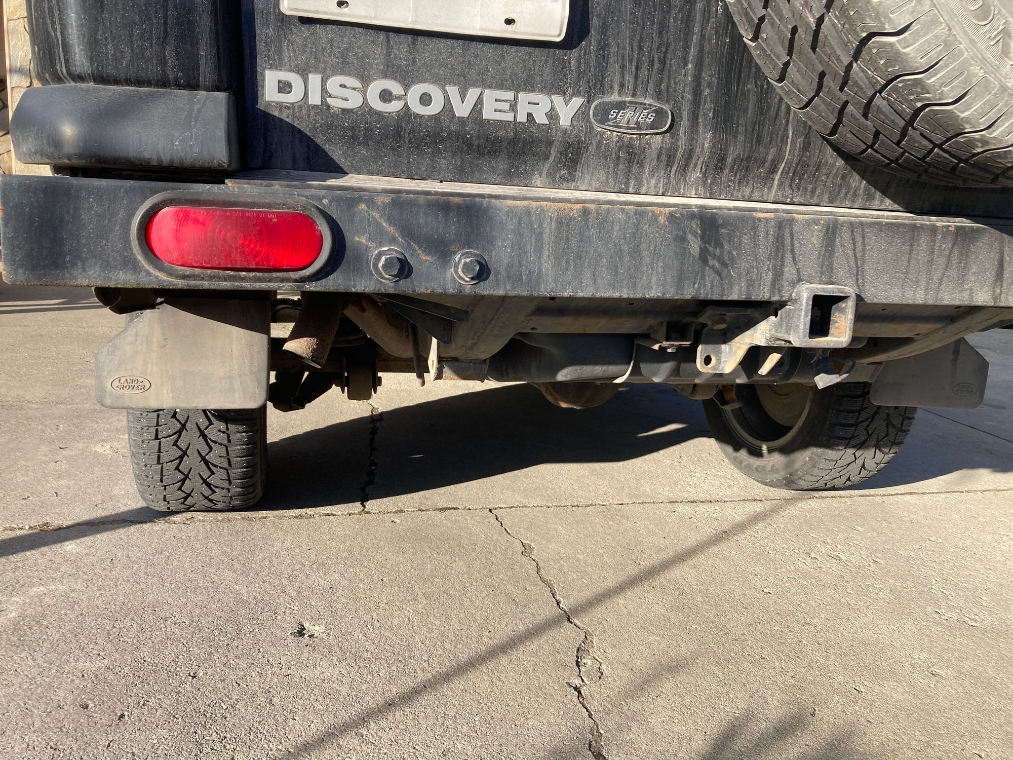 This is what I did (a couple of years ago) for the ridiculously low towing bracket. It probably still needs some better tweaking to make it ideal. Sorry for the late winter mud in the photo. I think the departure angle on the D2 might be its worst design feature. 