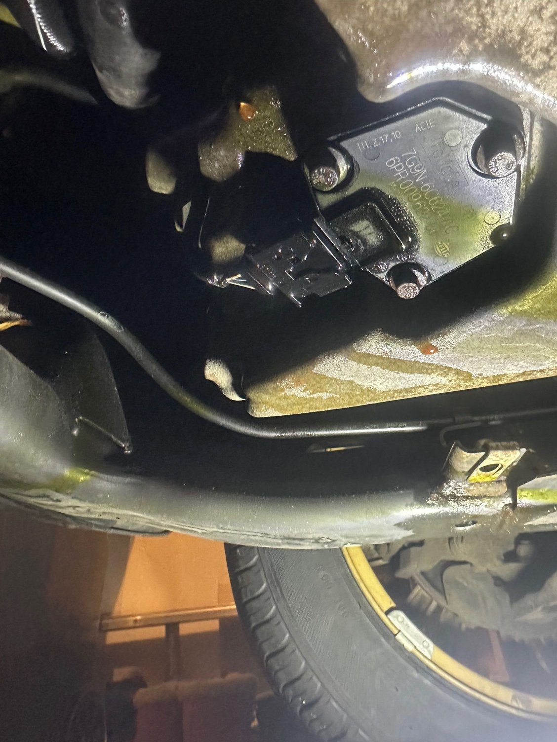 Hard to see in the picture, but it's still wet from the coolant leaking.  That's the front right tire.  