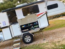 deployed state - manual or motorized vertical lift with manual queen size slide out bed. Propane outdoor galley with indoor galley with induction as a backup