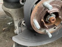 Could someone please tell me the measurement between the the two holes in this picture that hold the rear brake calipers? 
Thankyou in advance 👍🏻