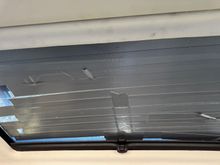 glass is cracked from hail.  have it tapped to keep it from further cracking.