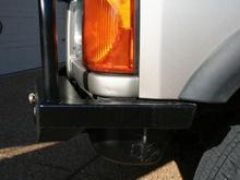 Driver's side.  I painted the reservoir black to match the bumper.  I know it needs to be moved, but I haven't had the time to do that yet.