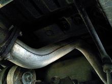 Exhaust pipe, bent from being rear-ended by an uninsured text-messaging 25-year old, who has agreed to pay for this and a new rear bumper. Her Volvo X70 caught my trailer hitch in the middle of its radiator.