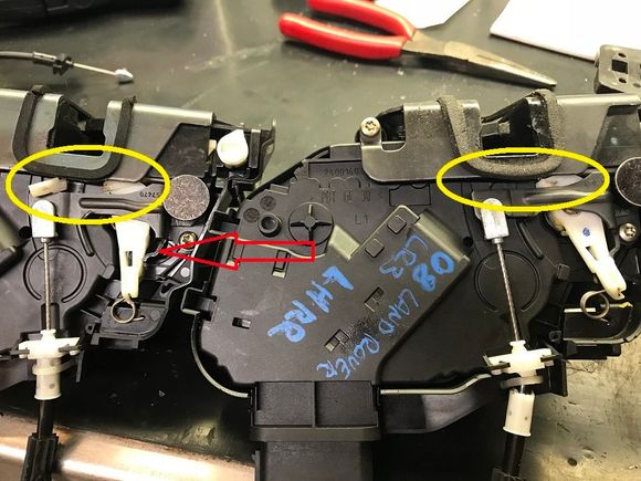 Yellow rings show the broken latches. Red arrow shows that part I bent leftwards to cause the lock mechanism to still operate with the broken latch.