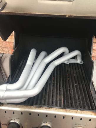 I painted my headers with ceramic high heat and treated them to harden the paint