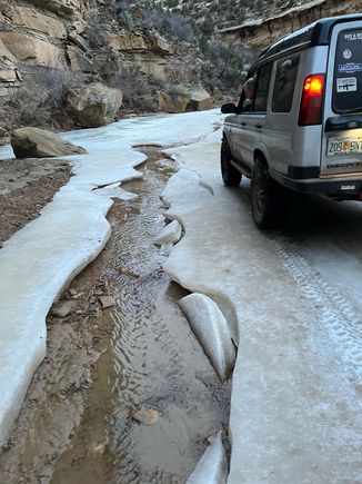 Driving over the frozen creek on the way to camp