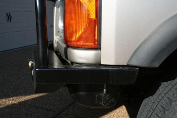 Driver's side.  I painted the reservoir black to match the bumper.  I know it needs to be moved, but I haven't had the time to do that yet.